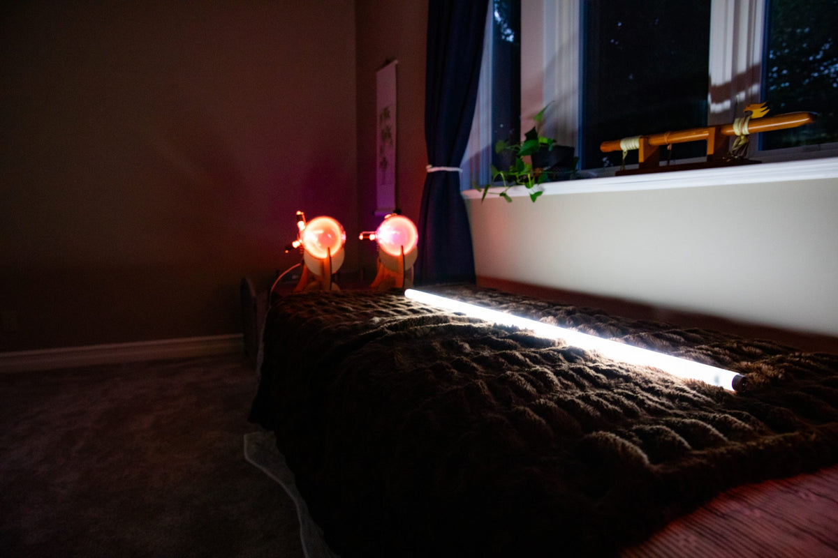 image showing a fluorescent bulb being lit up by the Theraphi bulbs